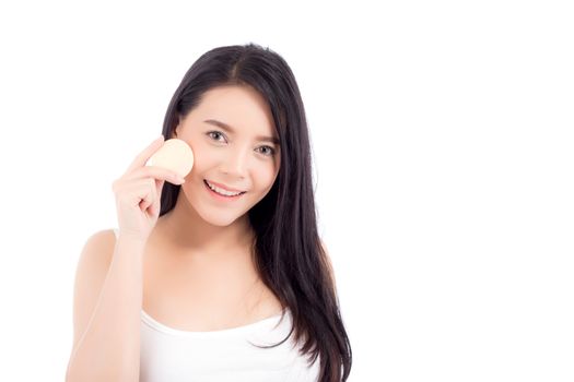 Portrait of beautiful asian woman applying powder puff at cheek makeup of cosmetic, beauty of girl with face smile isolated on white background, wellness and healthcare concept.