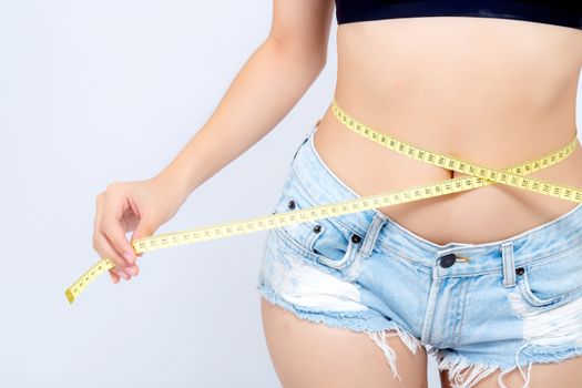 Asian woman diet and slim with measuring waist for weight isolated on white background, girl have cellulite and calories loss with tape measure, health and wellness concept.