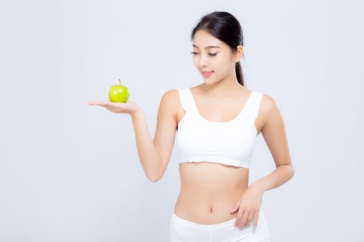 Portrait young asian woman smiling holding green apple fruit and beautiful body diet with fit isolated on white background, model girl weight slim with cellulite or calories, health and wellness concept.