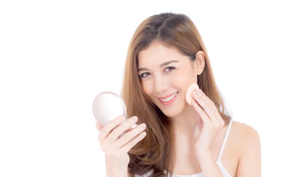 Portrait of beautiful asian woman applying powder puff at cheek makeup of cosmetic, beauty of girl with face smile isolated on white background, wellness and healthcare concept.
