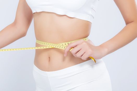 Asian woman diet and slim with measuring waist for weight isolated on white background, girl have cellulite and calories loss with tape measure, health and wellness concept.