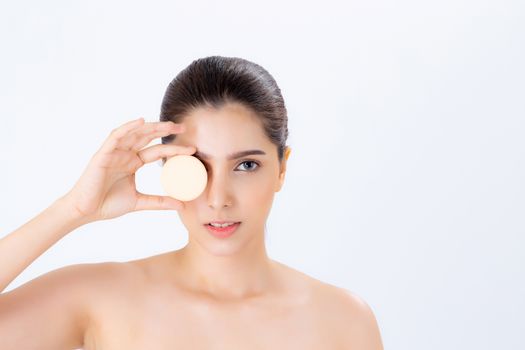 Portrait of beautiful asian woman applying powder puff at cheek makeup of cosmetic, beauty of girl with face smile isolated on white background, wellness and healthcare concept.