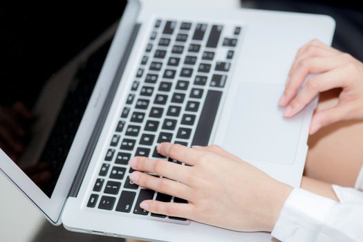 Closeup young asian woman using laptop for leisure on bedroom, girl working online with notebook freelance, business concept.