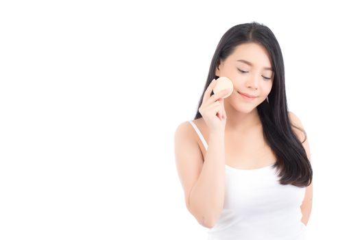 Portrait of beautiful asian woman applying powder puff at cheek makeup of cosmetic, beauty of girl with face smile isolated on white background, wellness and healthcare concept.