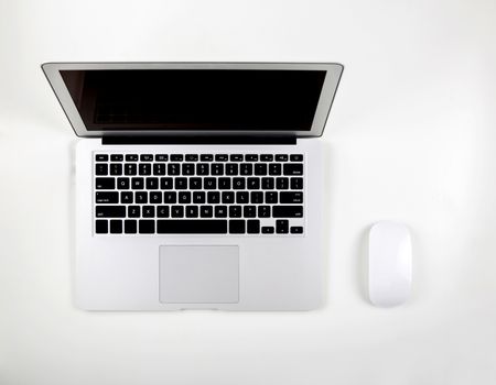 Top view of laptop computer with open display screen monitor and mouse isolated on white background, notebook or netbook with keyboard, communication technology concept.
