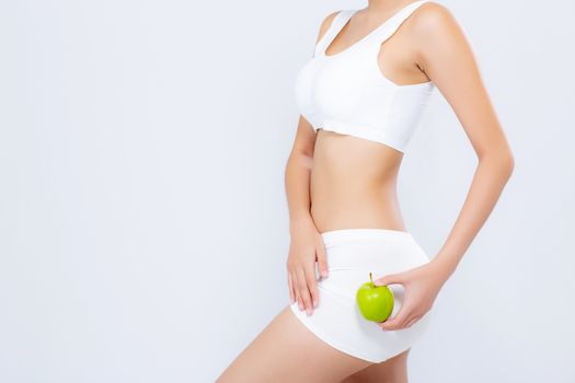 Closeup beautiful body woman sexy slim holding green apple with cellulite for wellness, girl waist thin with fitness for weight loss and healthy isolated on white background, healthcare and diet concept.