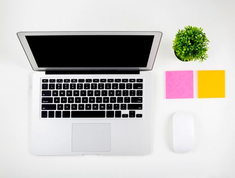 Top view of laptop computer with open display screen monitor, mouse and notepad isolated on white background, notebook or netbook with keyboard, communication technology concept.