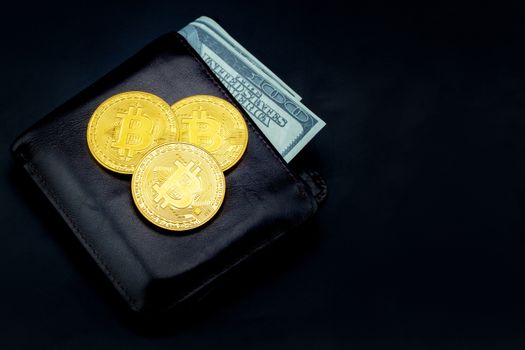 Gold bitcoin with leather wallet us dollar isolated on black background, coin money currency virtual digital exchange cash with crypto, technology finance trade, commercial business concept.