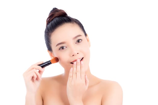 Beauty of portrait asian woman applying make up with brush of cheek isolated on white background, beautiful of girl holding blusher, skincare and cosmetic concept.