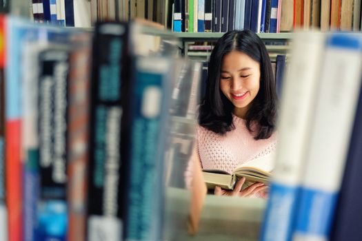 Young woman studying in library