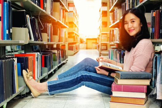 Young woman studying in library