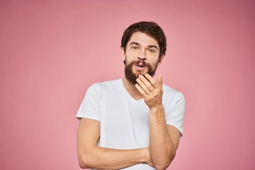 cheerful bearded man white t-shirt emotions cropped view pink background. High quality photo