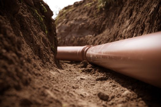 plastic pipes in the ground for wastewater and rainwater.