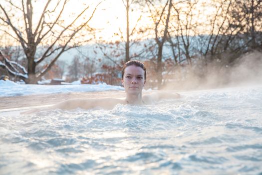 winter pool with a young attractive relaxing woman.