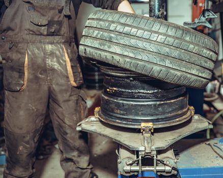 replacement of tires on car wheels.