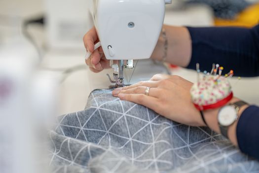 sew dressed on a sewing machine at home and in the studio.