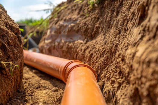 plastic pipes in the ground for wastewater and rainwater.