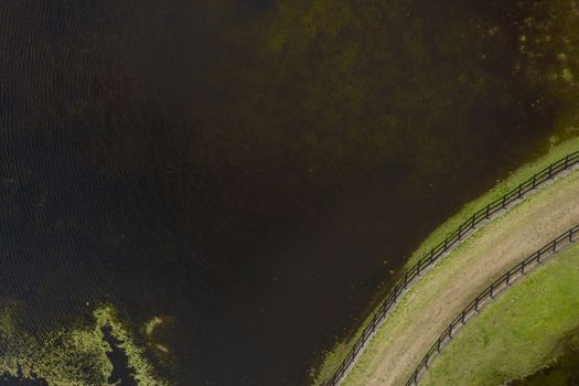 Aerial photograph of a horse trotting track near a fresh water lake in New South Wales in regional Australia