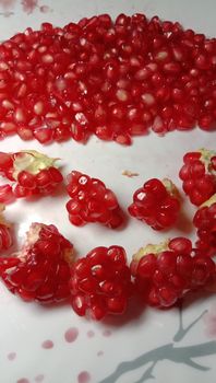 pomegranate seeds stock on plate for Guest