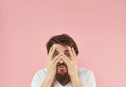 guy touches his head with his hands emotions and stress Model shock. High quality photo
