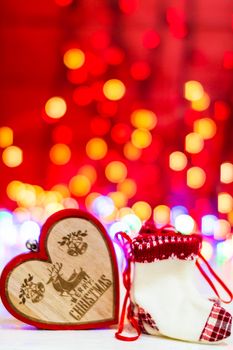 Decorations and ornaments in a colorful Christmas composition isolated on background of blurred lights.