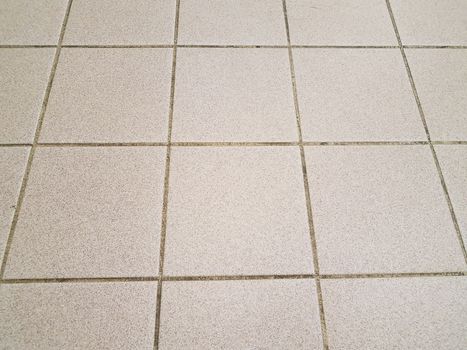 brown square kitchen tiles on the floor tessellation