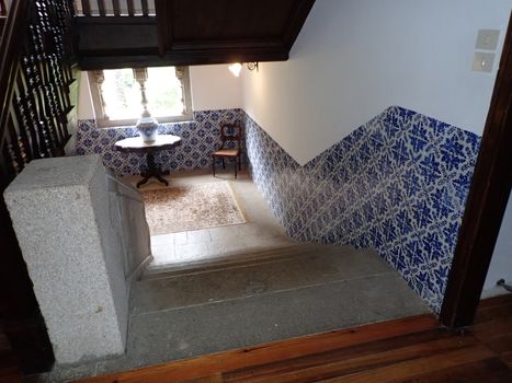 cement steps or stairs with blue tiles on the wall