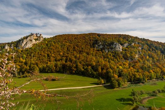 Colorful view of Bronnen Castle on the hiking trail in autumn in the Danube Valley near Beuron in the Sigmaringen district