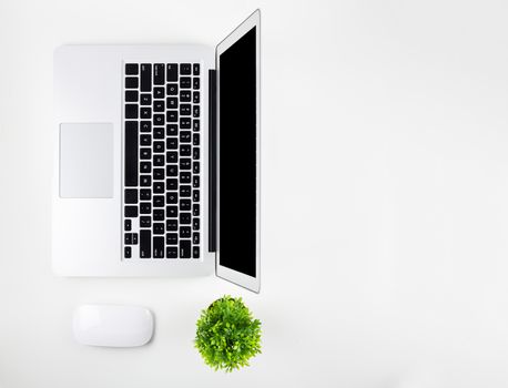Top view of laptop computer with open display screen monitor, diary and mouse isolated on white background, notebook or netbook, communication technology on work office concept.