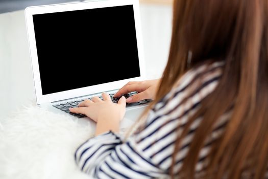 Beautiful asian young woman lying on bed using laptop at bedroom for leisure and relax, freelance with girl working notebook, communication concept.