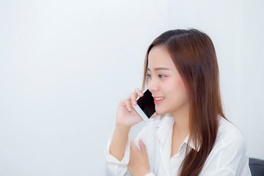 Beautiful of portrait young asian woman smiling sitting relax on the chair, girl using mobile smart phone talking enjoy, communication and social network concept.