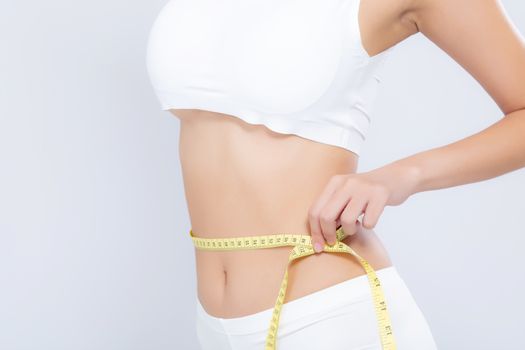 Asian woman diet and slim with measuring waist for weight isolated on white background, girl have cellulite and calories loss with tape measure, health and wellness concept.