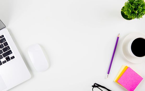 Top view of laptop computer with open display screen monitor, mouse and notepad, glasses and pencil isolated on white background, notebook or netbook with keyboard, communication technology concept.