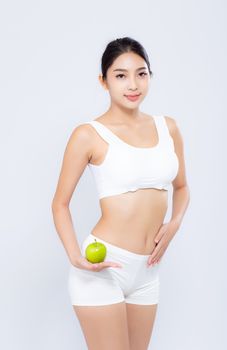 Portrait asian woman smiling holding green apple fruit and beautiful body diet with fit isolated on white background, girl weight slim with cellulite or calories, health and wellness concept.