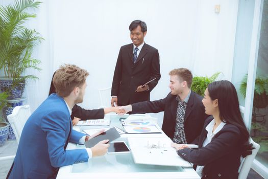 Group of business team people shaking hand with success, agreement of discussion with handshake after meeting  in teamwork, communication concept.