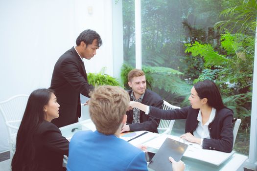 Group of business team people shaking hand with success, agreement of discussion with handshake after meeting  in teamwork, communication concept.