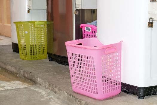 Basket of clothes to wash and prepare.