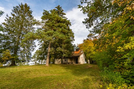 Trinity Chapel on the hiking trail in the Danube Valley in colorful autumn near Beuron in the Sigmaringen district