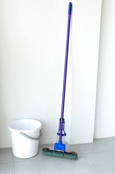 Mop purple And white water tank on white background.