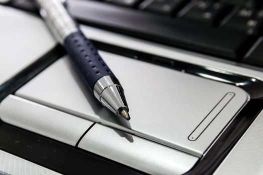 Notebook touchpad and multimedia connectors.