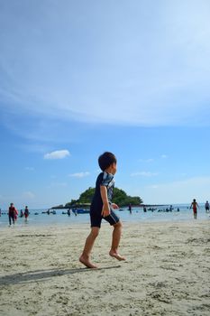 Rayong,Thailand,May5th,2014:The boys are happy and fun to see the ocean for the first time.