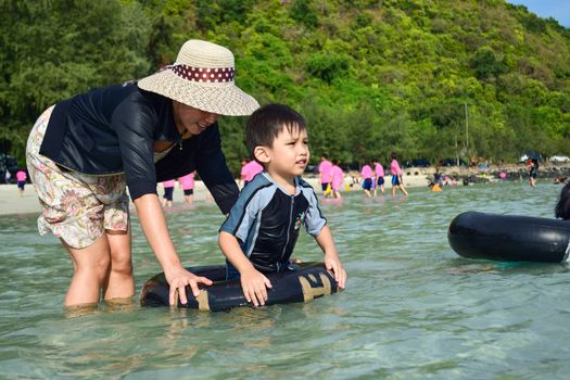 Rayong,Thailand,May5th,2014:The boys are happy and fun to see the ocean for the first time.