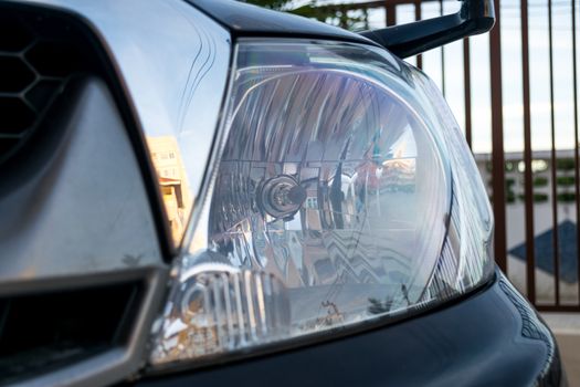 Headlight a powerful light at the front of a motor vehicle