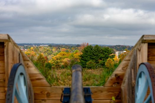The Top of Vibrant Autumn Trees Over a CAnnon At Valley Forge National Historical Park