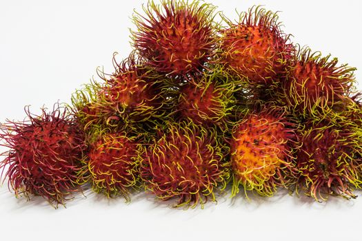 Rambutan thai fruits a red, plum-sized tropical fruit with soft spines and a slightly acidic taste.