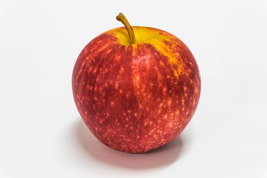 Red apple with white background.