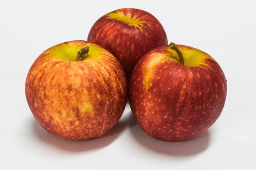 Red apple with white background.