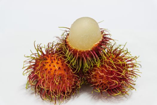 Rambutan thai fruits a red, plum-sized tropical fruit with soft spines and a slightly acidic taste.