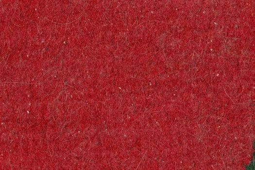domestic cat hair, fur and dust pollution on red flat carpet surface texture and background