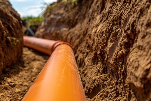 plastic pipes in the ground for wastewater and rainwater.